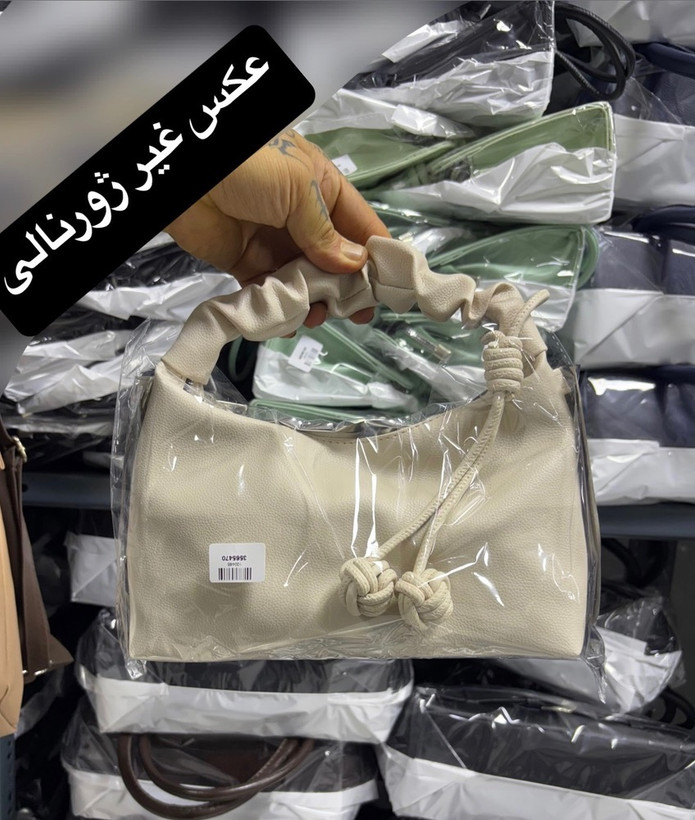 کیف زنانه شل منگولهدار نود با دسته چیندار